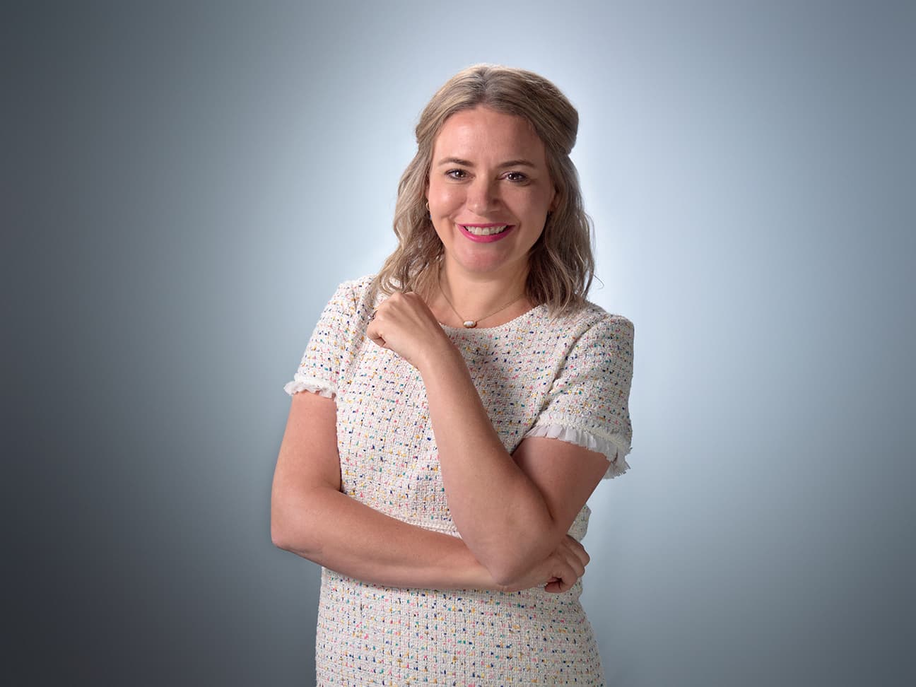 Headshot of Dawn Hawkins, smiling with arms crossed