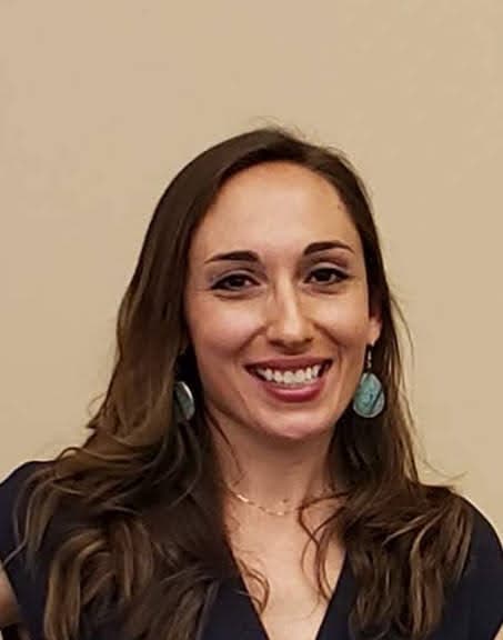 Headshot of Melissa Sinclair, BSN, RN, smiling against a neutral background